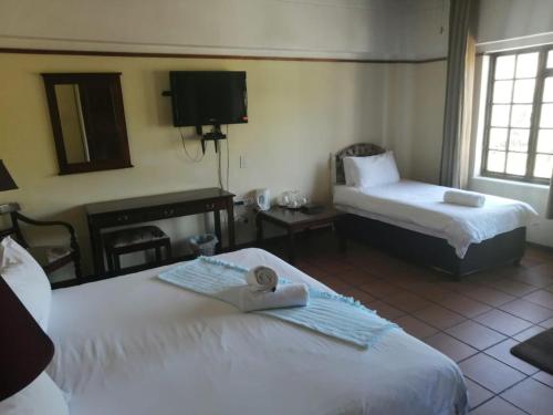 Katil atau katil-katil dalam bilik di The Woodsman Bed and Breakfast