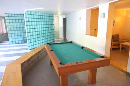 a pool table in the middle of a room at Jugendherberge Flensburg - Membership required in Flensburg