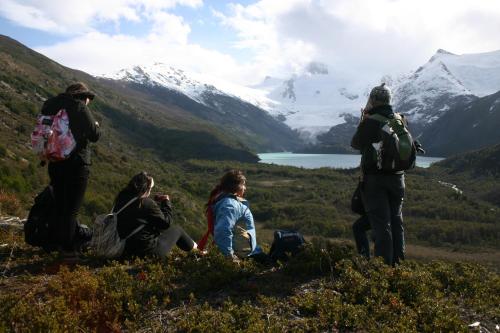a group of people standing on top of a mountain at Lodge El Mirador De Guadal in Puerto Guadal