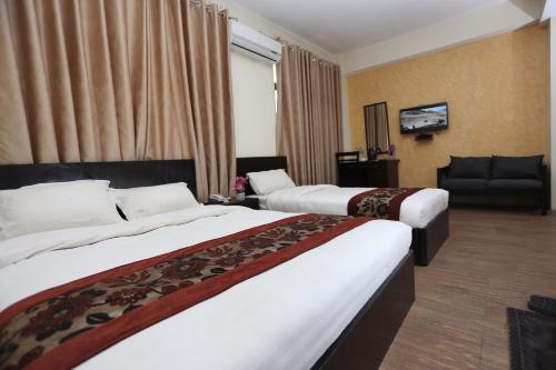 Postel nebo postele na pokoji v ubytování Hotel Hema