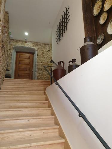 a staircase in a house with wooden floors at Casa da Sé by PURUS in Coimbra