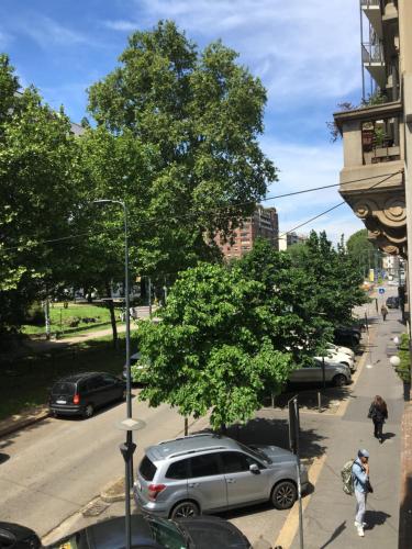 a street with cars parked on the side of the road at APARTHOTEL CASA MIA in Milan