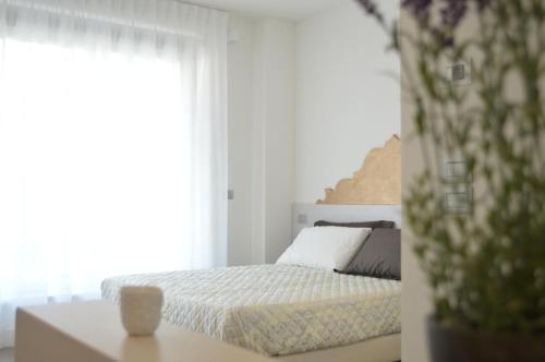 Ένα ή περισσότερα κρεβάτια σε δωμάτιο στο Residenza Domo