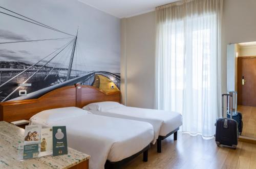 Voodi või voodid majutusasutuse B&B Hotel Pescara toas