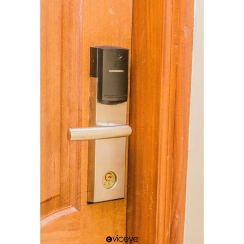a soap dispenser attached to a wooden door at Grand Winston Hotel in Nakuru