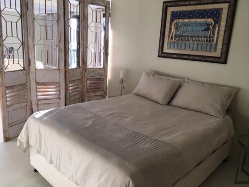 Klein Windhoek Garden flat tesisinde bir odada yatak veya yataklar