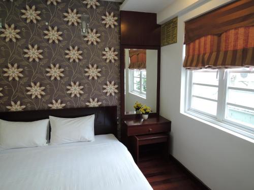 Giường trong phòng chung tại Alupoint Hotel
