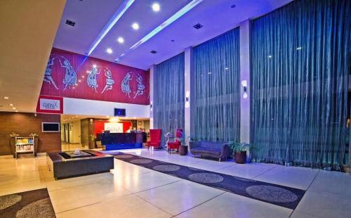 a large lobby with a large window and a lobby at Hotel Clarks Collection Bhavnagar in Bhavnagar