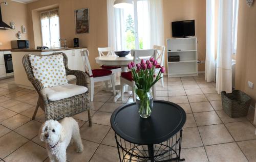 a living room with a vase of flowers on a table at A Dream On The Lake in Lierna
