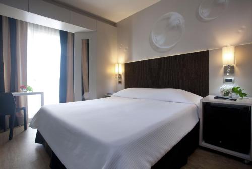 Ένα ή περισσότερα κρεβάτια σε δωμάτιο στο Two Hotel Buenos Aires