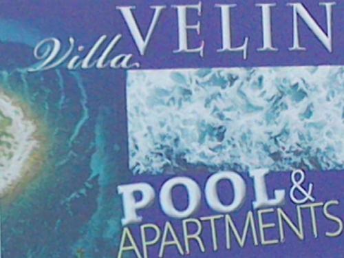 um livro com as palavras villa suplementos vitamínicos e polares em Apartments Villa Velin em Primošten