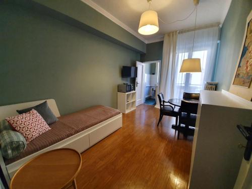a living room with a couch and a table at Residence Pian della Nave in Milan