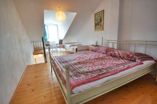 a bedroom with a bed with a quilt on it at Villa Carmen in Sali