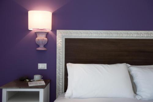 Postel nebo postele na pokoji v ubytování Taormina Mare Apartments,Suites & Beachclub