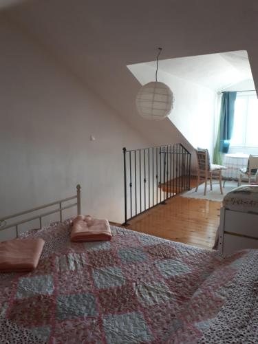 a bedroom with a large bed and a staircase at Villa Carmen in Sali