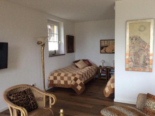 Кровать или кровати в номере Wollmeiner's Lodge