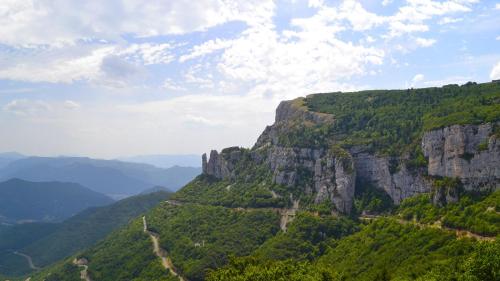 a view of a mountain with a road at Glamping Villatent at Le Lac Bleu in Châtillon-en-Diois