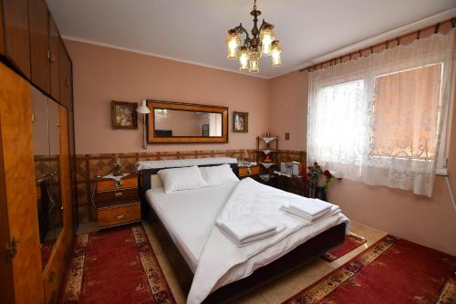 Postel nebo postele na pokoji v ubytování Kaza apartment