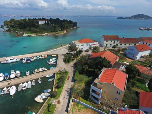 an aerial view of a harbor with boats in the water at Apartmani Junto in Preko