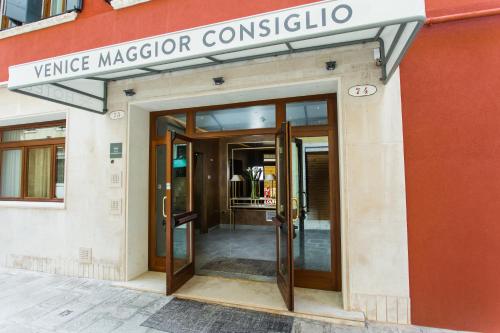 an entrance to a building with a revolving door at Venice Maggior Consiglio in Venice