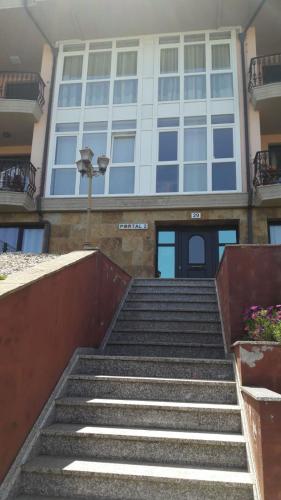 a set of stairs leading up to a building at Panoramico Playa de Altar I in Barreiros