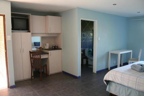 Η κουζίνα ή μικρή κουζίνα στο Columbus Guest House