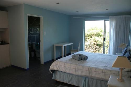 Ένα ή περισσότερα κρεβάτια σε δωμάτιο στο Columbus Guest House