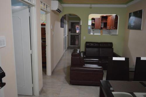 a living room with a couch and a chair at The Clover 20-28 in Palmira