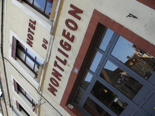 a sign for a hotel on the side of a building at Logis- Hôtel & Restaurant Le Montligeon in La Chapelle-Montligeon
