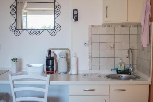 Virtuvė arba virtuvėlė apgyvendinimo įstaigoje Apartments and Rooms PUNTA