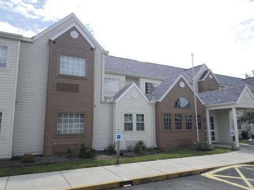 a house on a street at Microtel Inn & Suites by Wyndham Riverside in Dayton