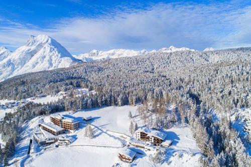 an aerial view of a ski resort in the snow at Hotel Lärchenhof Natur in Seefeld in Tirol