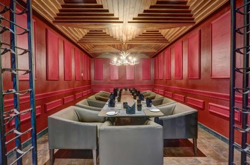 a dining room with a long table and chairs at Royalton Antigua, An Autograph Collection All-Inclusive Resort in Five Islands Village