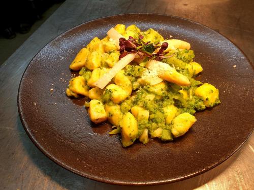 a brown plate of food on a wooden table at Pension Gasthof Haselstaude in San Leonardo in Passiria