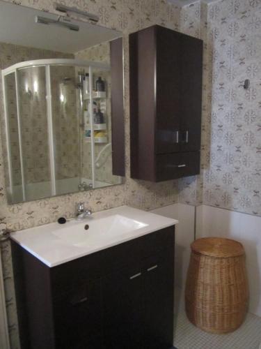 a bathroom with a sink and a mirror at Los Valles 4 in Biescas