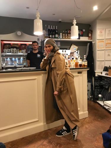 a woman standing in front of a counter at Hotel Casa Arizzoli in Cannobio