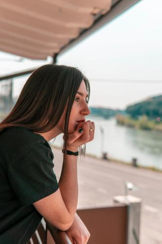 a woman is talking on a cell phone at Alla Riva in Verona