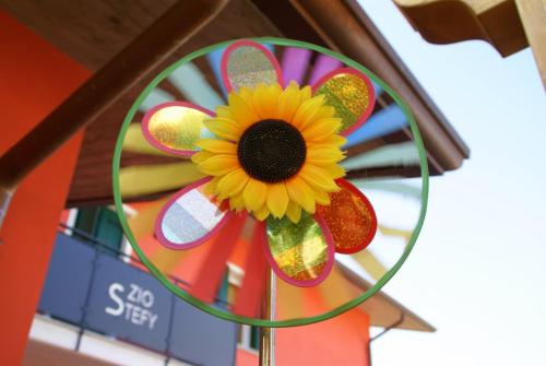 a sunflower decoration hanging from the ceiling of a building at Zio Stefy in Cittadella