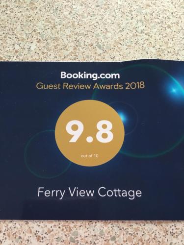 a blue credit card with a sign that says ferry view cottage at Ferry View Cottage in Belmullet