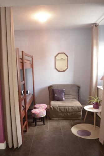 a living room with a couch and a chair at Ondoria in Itxassou