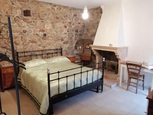 A bed or beds in a room at La casa di Duilia