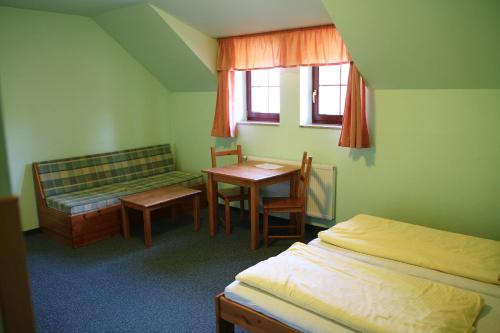 Postel nebo postele na pokoji v ubytování Schneeberg Apartmany