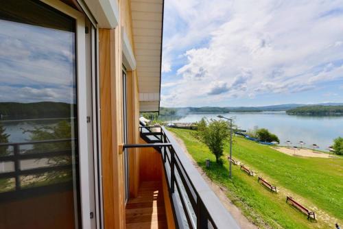 a window view of a lake from a house at Willa Admirał Solina in Solina