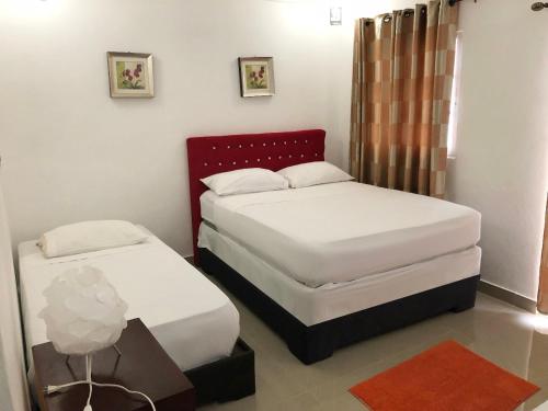 Postel nebo postele na pokoji v ubytování Daymond Blue Tropical Lodge