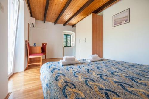 a bedroom with a large bed in a room at Apartment Meri - sea view & serenity in Božava