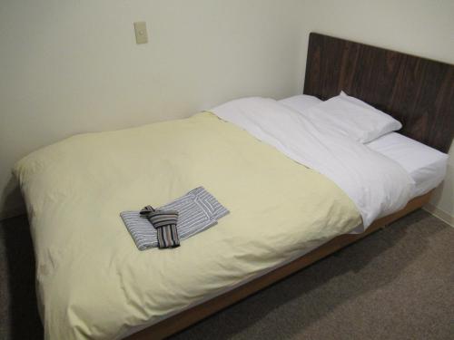 En eller flere senge i et værelse på Hotel Crown Hills Kitami Annex