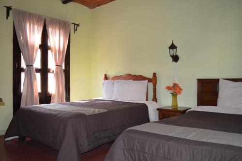 Postel nebo postele na pokoji v ubytování Hotel Dos Rios
