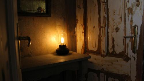 a candle sitting on a table in a room at VINTAGE in Old Town in Kecskemét