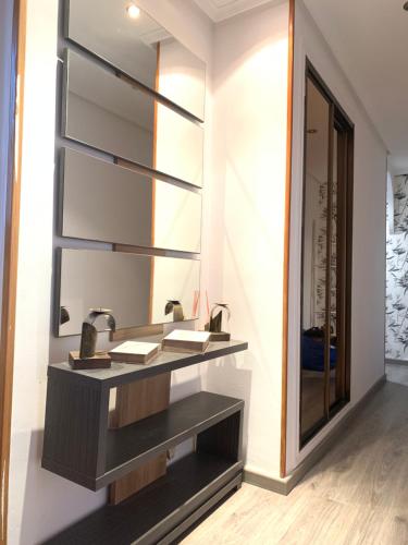 a bathroom with a sink and a mirror at La Perla del Pirineo in Jaca