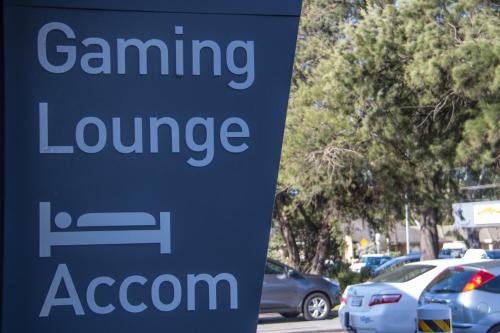 a sign for a parking lot with cars parked at Lockleys Hotel in Adelaide